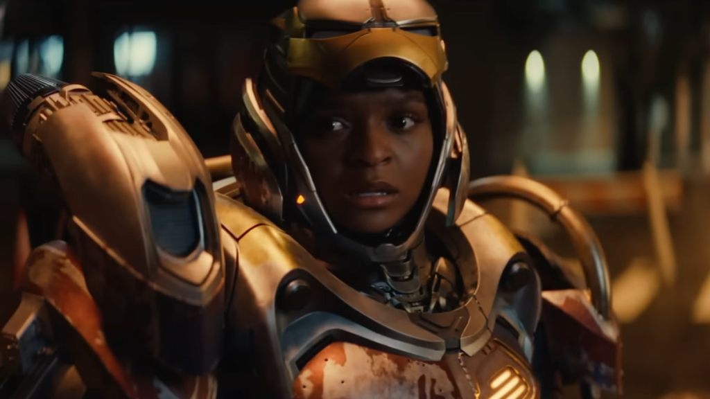 Ironheart waring a golden suit with the mask open