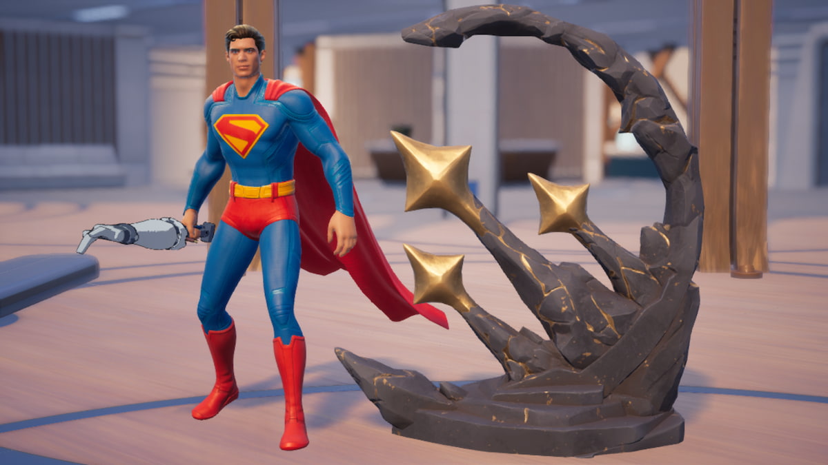 Superman standing by a grey, rocky spire monument with three golden stars on it in Fortnite